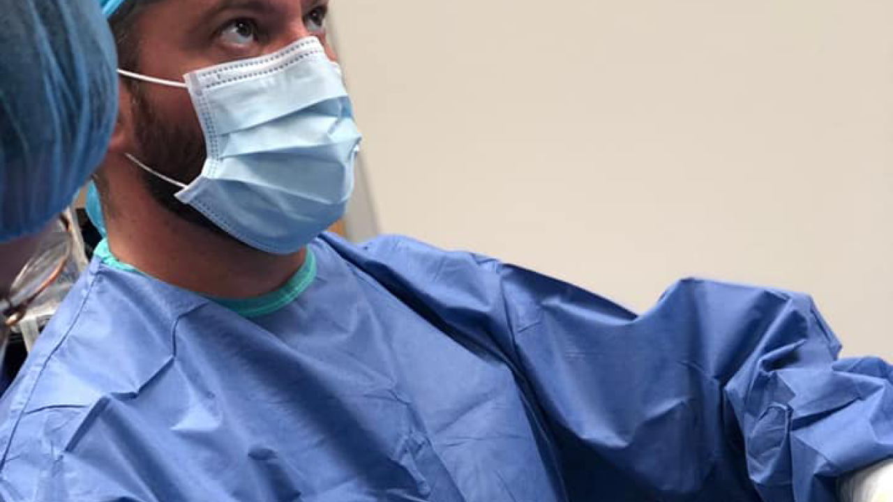 Doctor performing procedure.