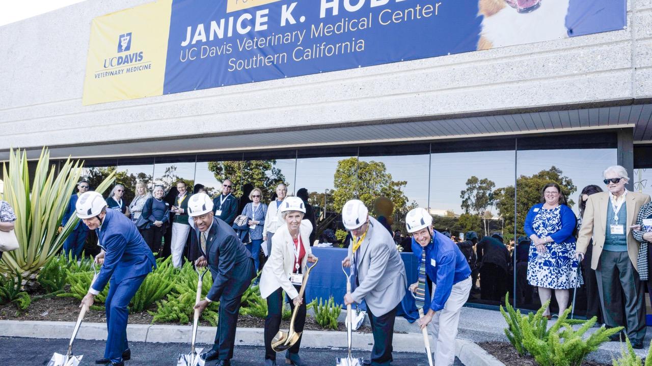 People with shovels digging into ground in front of building that will be the new Hobbs Center UC Davis.