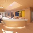 Room with warm coloring, people at a desk.